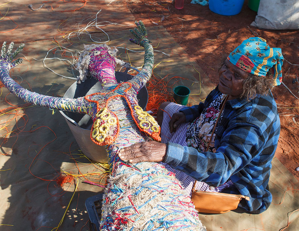 'Elaine prods the figure to test its density and sturdiness. If too loose, the figure could unravel. A lot of stitching is required to make the figure tight and durable.'