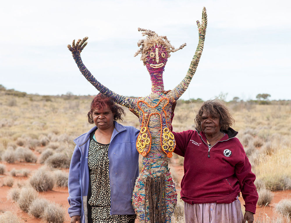 'Mother-and-daughter team, Elaine Warnatjura Lane and Janet Nuyunkanya Lane, worked together on this sculpture. Elaine is a seasoned <em>tjanpi</em> artist while her daughter only occasionally works in this medium.'